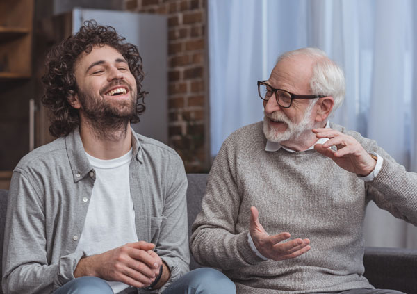 Two men talking and laughing